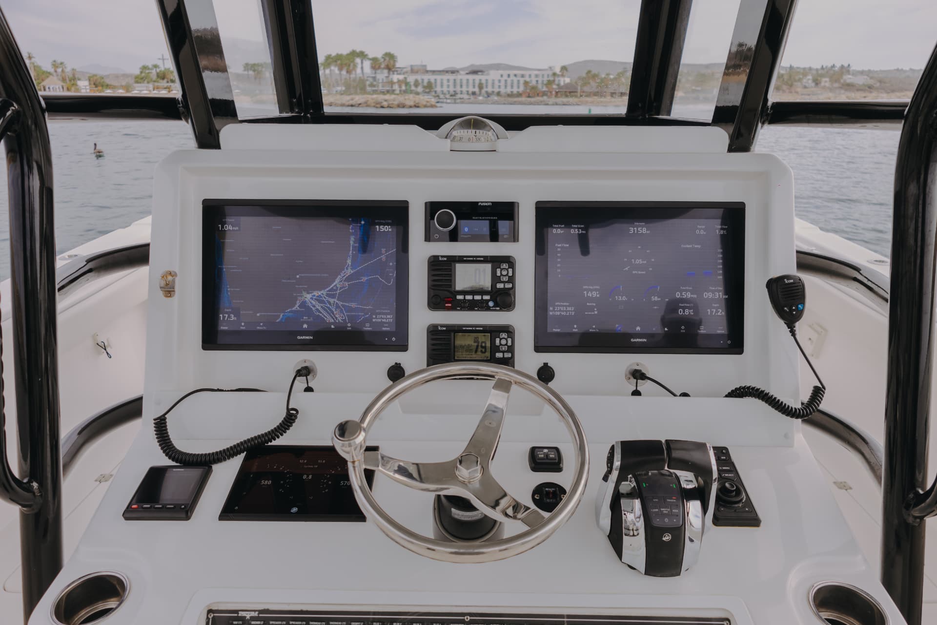 Helm of the 34ft Invincible catamaran with dual Garmin screens in San José del Cabo